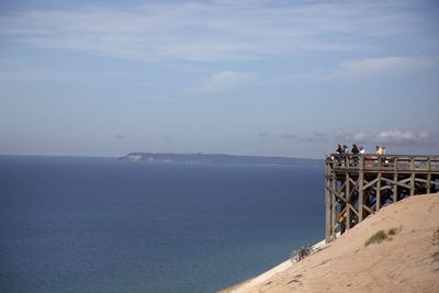 Scenic view of shore and sea against sky