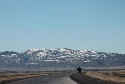 Scenic view of mountain road against clear sky