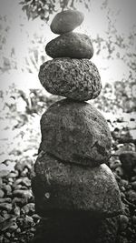 Close-up of stone stack at shore