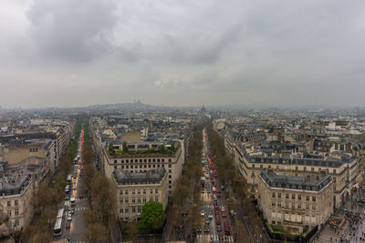 High angle view of city against cloudy sky