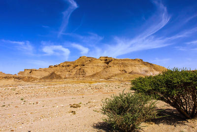 Rock formations on landscape against sky