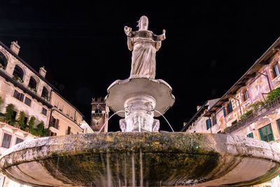 Low angle view of statue against sky at night