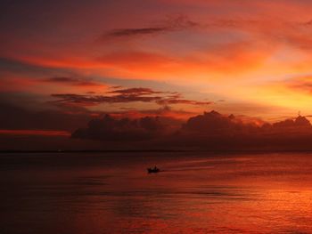 Scenic view of sea against orange sky