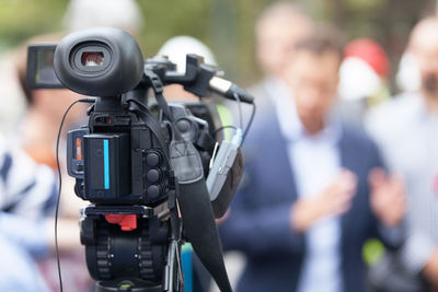 Reflection of man photographing on camera