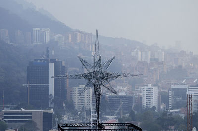 Buildings in city against sky