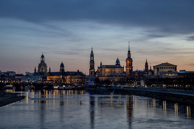 Illuminated buildings in water