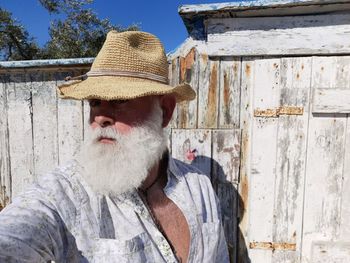 Man wearing hat while standing outdoors