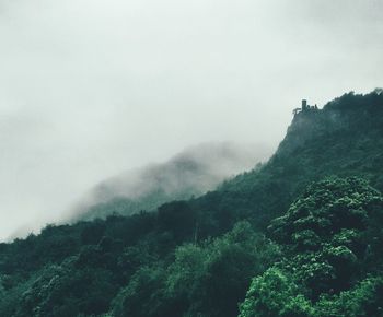 Scenic view of mountains in foggy weather