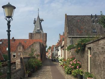 Street amidst buildings against sky