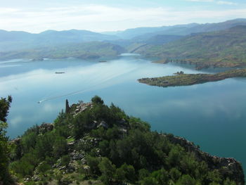 High angle view of trees and mountains against sky