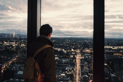 Cityscape against cloudy sky