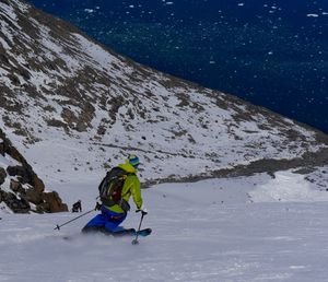 People skiing on snowcapped mountain