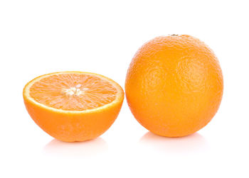 Close-up of orange fruit against white background