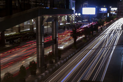 High angle view of light trails on city street at night