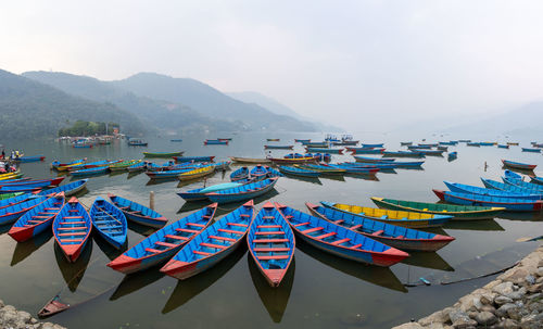 Boats moored at harbor