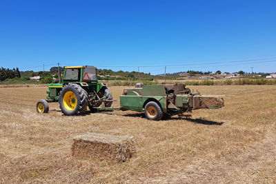 Harvesting hay bales in the countryside from portugal