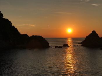 View of calm sea at sunset