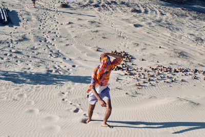 High angle view of man on sand at beach