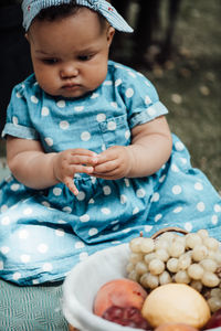 Cute baby girl holding ice cream