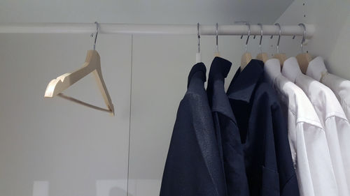 Close-up of clothes hanging on rack