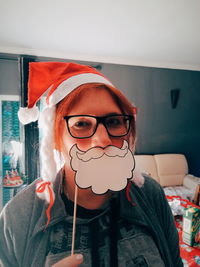 Portrait of girl wearing eyeglasses at home