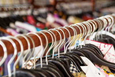 Close-up of coat hanging for sale at store