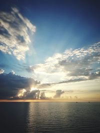 Scenic view of sea against sky at sunset