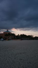 Scenic view of beach against sky during sunset