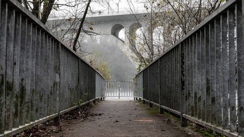 Empty footpath along bridge