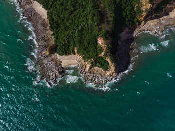 High angle view of water flowing through rocks