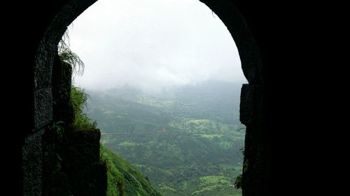 Scenic view of landscape seen through window of fort