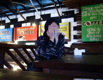 Full length of woman standing in restaurant