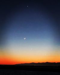 Scenic view of silhouette landscape against sky at sunset