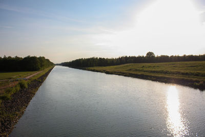 Scenic view of road by land against sky