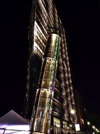 Low angle view of illuminated building at night