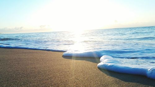 View of calm beach against the sky