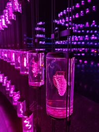 Close-up of illuminated candles on table