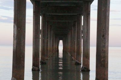 Underneath view of bridge against sky