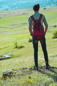 Rear view of man standing on field