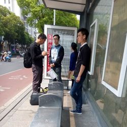 People on escalator in city