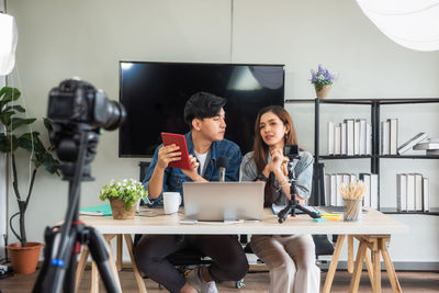 Couple vlogging at studio