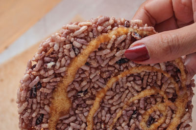 Close-up of hand holding ice cream