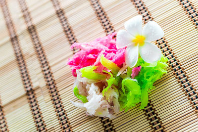 High angle view of pink flowering plant on table