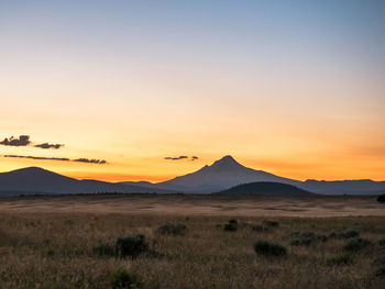 Scenic view of landscape against sky during sunset