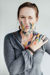 Portrait of a beautiful young woman over white background