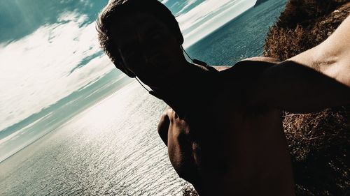 Midsection of man at beach