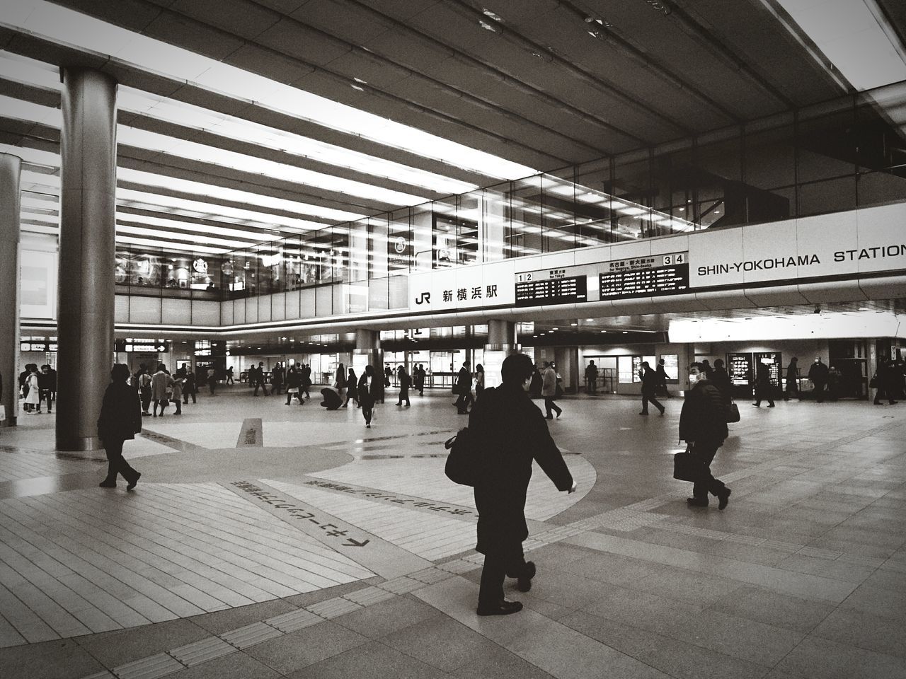 indoors, railroad station, public transportation, railroad station platform, men, person, large group of people, lifestyles, architecture, built structure, transportation, walking, subway station, passenger, rail transportation, city life, travel, ceiling, flooring