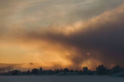 Scenic view of landscape against sky during sunset