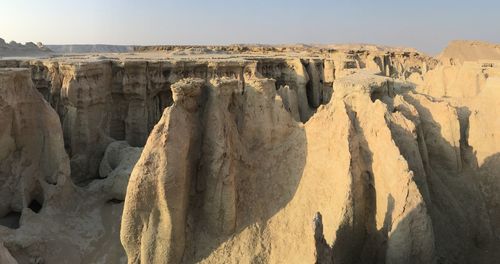 Panoramic view of rock formations against sky