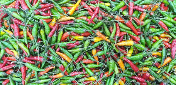 Full frame shot of red chili peppers at market